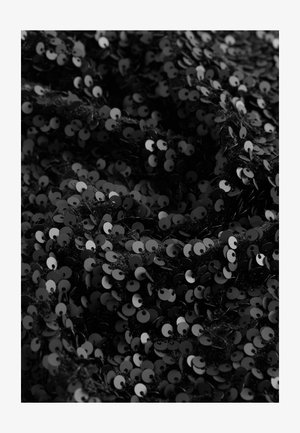 Black sequined fabric with a dense arrangement of reflective circular sequins, creating a textured surface with varying light reflections.