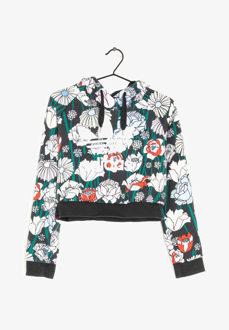Felpa nera cropped con un motivo floreale con fiori rossi, bianchi e blu, cordini e orlo e polsini neri a tinta unita.