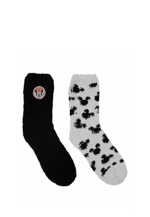 Black fuzzy sock with Minnie Mouse patch and gray fuzzy sock with black Minnie Mouse head patterns, arranged side by side.