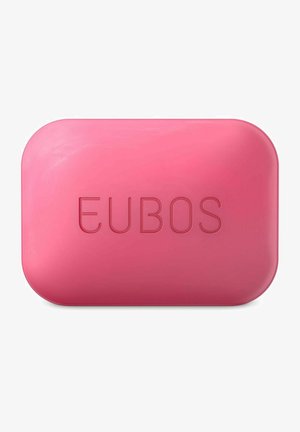 Rosa rechteckiger Seifenblock mit abgerundeten Kanten, in der Mitte mit dem Markennamen "EUBOS" geprägt.