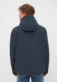 Navy blue, softshell jacket with a hood, featuring a smooth texture, and a simple, contemporary design. No visible fastenings or patterns.