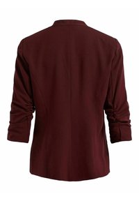 Veste rouge foncé avec manches longues froncées vue de dos sur un fond blanc uni.