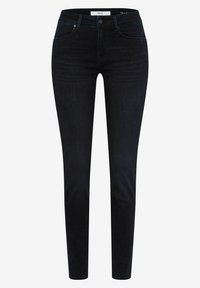 Skinny jeans in donkerblauwe denim met een gladde textuur, voorzien van een middelhoge taille, vijf zakken en minimale hardwaredetails.