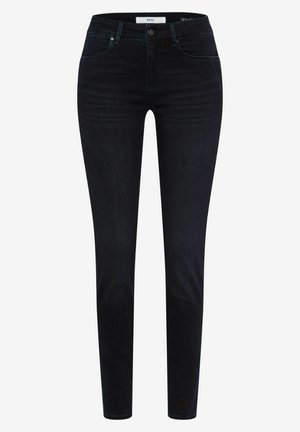 Skinny jeans in dark blue denim with a smooth texture, featuring a mid-rise waist, five pockets, and minimal hardware detail.