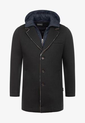 Black coat with a fitted design, notched lapels, five buttons, and a navy hood. Features a smooth, textured exterior and side pockets.