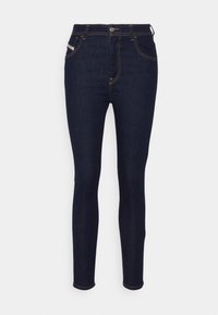 Mörkblå slim fit jeans i denim, med fem fickor, gul söm och framknäppning. Inga synliga mönster eller logotyper.