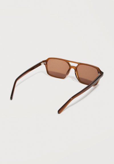 Brown translucent rectangular sunglasses with wide temples, angled slightly upward on a white background.