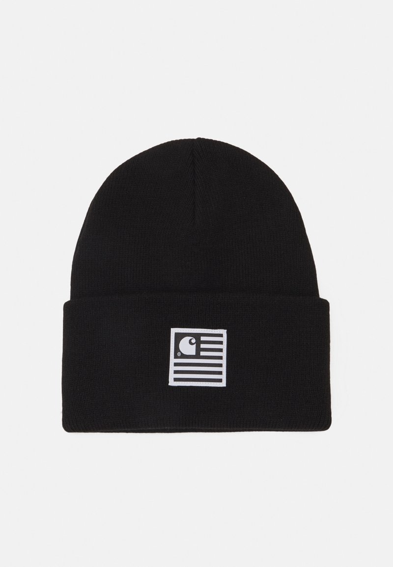 Bonnet en tricot noir avec bord roulé, arborant un logo carré blanc combinant un "C" stylisé et des rayures horizontales.