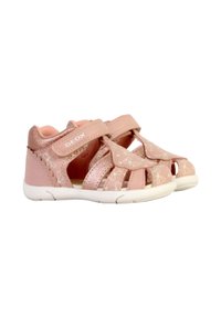 Sandali rosa in pelle con motivi floreali, cinturini in velcro regolabili e suola in gomma bianca per traspirabilità e comfort.