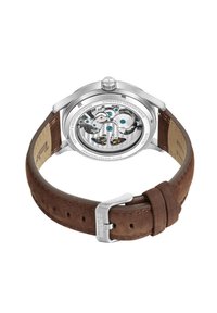 Orologio automatico con fondello trasparente, cassa in acciaio inossidabile, cinturino in pelle marrone e fibbia in metallo. Movimento intricato visibile all'interno.