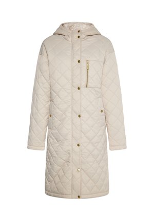 Pitkä beige vuorattu takki hupulla, kultaisilla napilla, vetoketjullisella rintataskulla ja kahdella sivutaskulla. Pehmeä pinta modernilla muotoilulla.
