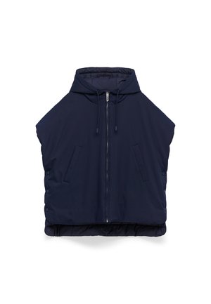 Marineblauwe gewatteerde vest met hoge kraag, ritssluiting en twee voorzakken. Bevat drukknoopjes aan de zijkanten en heeft een licht cropped ontwerp.