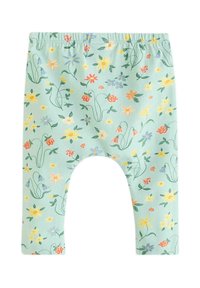 Hellgrüne Leggings mit floralem Muster in Gelb, Rot und Blau. Weicher Stoff mit elastischem Bund und schmalem Schnitt am Knöchel.