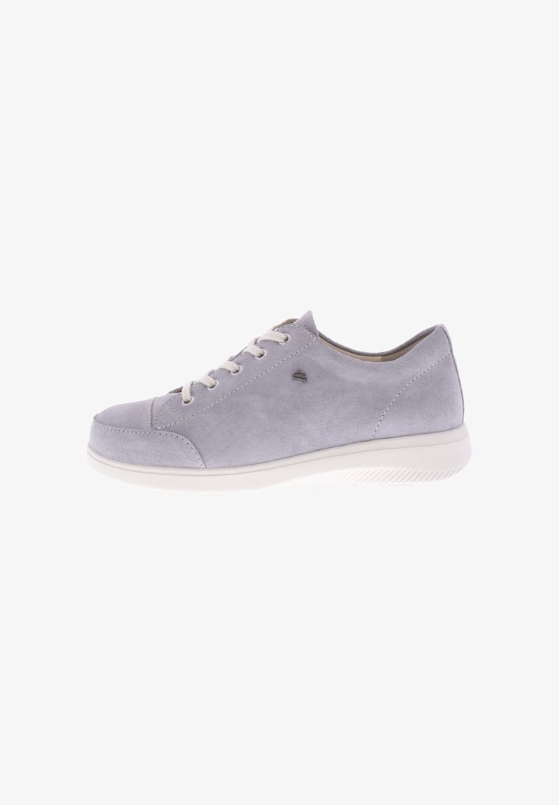 Grey suede sneaker with white rubber sole and round toe. Features white laces and a small logo detail on the side. Smooth texture throughout.