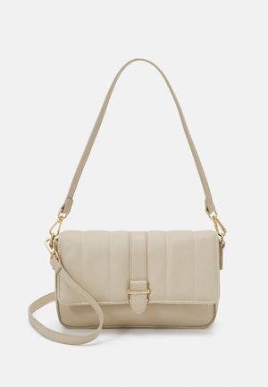 Beige quilted shoulder bag with a gold buckle clasp, adjustable straps, and a smooth rectangular shape.