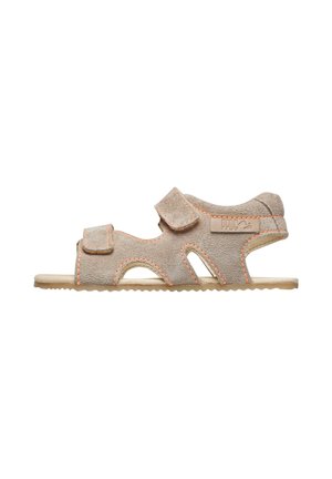 Child's beige suede sandal with two adjustable Velcro straps and open side cutouts on a flat sole.