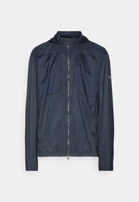 Veste légère à capuche bleu marine avec fermeture éclair sur toute la longueur, manches longues et poche poitrine zippée.