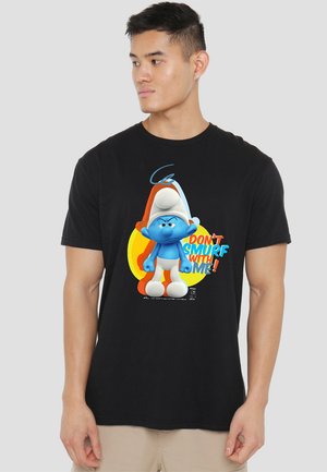 Black t-shirt featuring a blue cartoon character with a white hat and orange accents. Graphic text reads “DON'T SMURF WITH ME!”