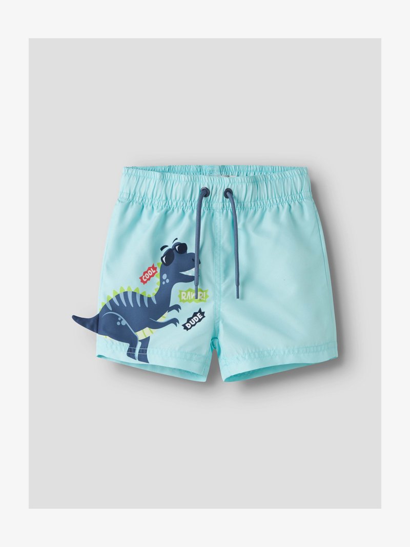 Shorts de bain pour enfants bleu clair avec un dinosaure bleu cartoon portant des lunettes de soleil et les mots « Cool », « Rawr ! » et « Mec » sur la jambe gauche.