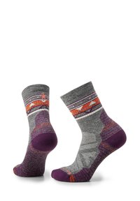 Grey and purple socks featuring a geometric pattern with orange accents on the band, textured fabric, and cushioned purple soles.