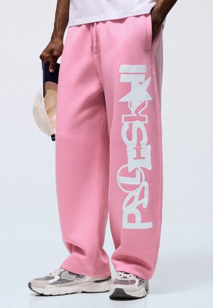 Bershka BALLOON FIT WITH SIDE PRINT - TROUSERS - Pantalon de survêtement - light pink