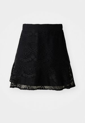 Μαύρη δαντελένια φούστα με περίπλοκα γεωμετρικά σχέδια, φουσκωτή γραμμή και ελαστική μέση. Διαθέτει στρωτό στρίφωμα για επιπλέον διάσταση.