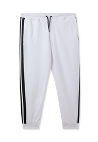 Pantaloni della tuta bianchi con strisce laterali nere, vita con coulisse, polsini elasticizzati e una superficie in tessuto liscia. Presenta due tasche laterali.