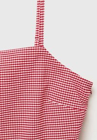 Red and white gingham-patterned top with thin straps, featuring a textured fabric and a fitted design.