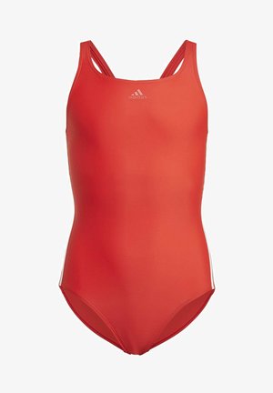 Bañador rojo de una pieza fabricado con tejido suave, con escote redondeado, tirantes finos y acentos laterales en blanco. Logo de Adidas en el pecho.