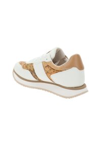 White sneaker with a textured golden-brown map print on the side, tan heel accent, and a thick white sole. Laced design and padded collar.