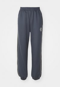HOME GROUND TRACKPANT - Tracksuit bottoms - marine blue