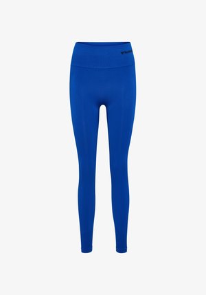 Blauwe legging gemaakt van rekbare stof. Hoge tailleband met zwart logo. Gladde textuur met een aansluitende pasvorm.