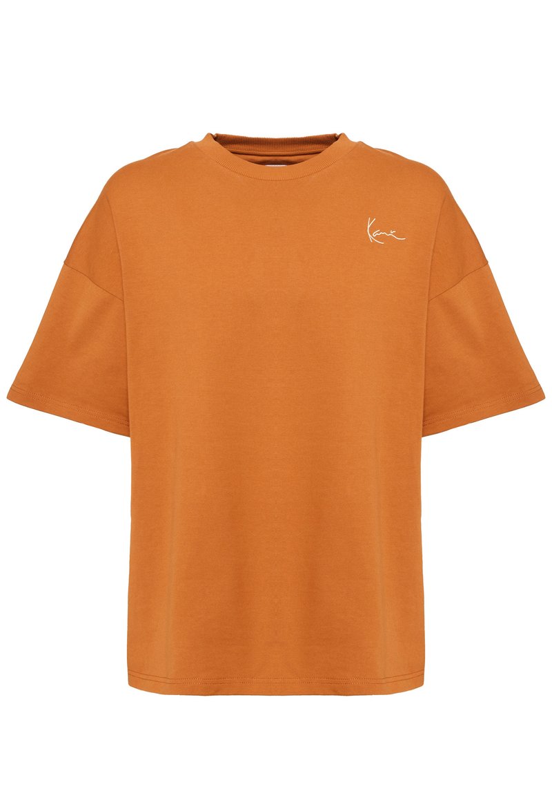 Tricou supradimensionat portocaliu din bumbac, cu guler rotund și mâneci scurte. Are un mic logo alb pe partea stângă a pieptului.