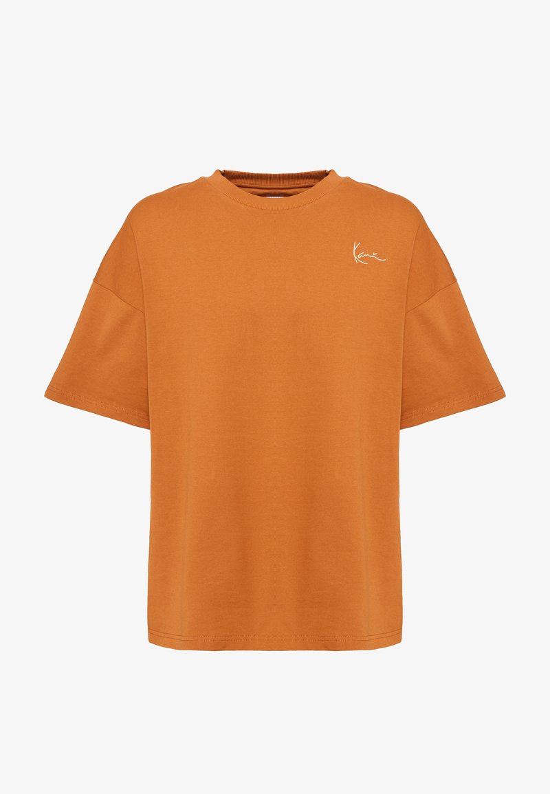 Tricou supradimensionat portocaliu din bumbac, cu guler rotund și mâneci scurte. Are un mic logo alb pe partea stângă a pieptului.