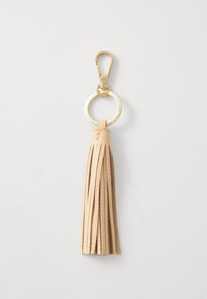 Portachiavi in pelle con nappine di colore beige, dotato di un gancio in metallo dorato e di un anello circolare, con diverse frange testurizzate.