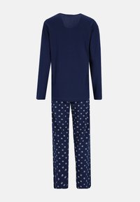 Navy long-sleeve top with a rounded neckline, paired with floral-patterned navy pants featuring small white blossoms on a dark background.