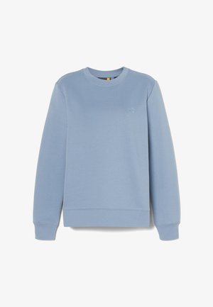 Sweatshirt bleu clair en tissu doux. Présente un col rond, des manches longues et un petit logo brodé sur la poitrine. Design simple.