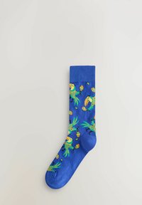 Blue sock with colorful toucan and maracas pattern, laid flat on a light gray background.
