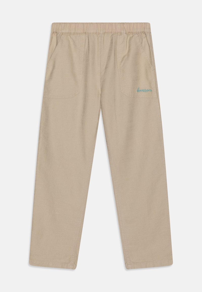 Beżowe spodnie z elastycznym paskiem w pasie, z bocznymi kieszeniami, w luźnym kroju i niebieskim haftem na tylnej kieszeni. Miękka tekstura materiału.