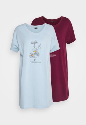 Two short-sleeve t-shirts, one light blue with floral print, one burgundy, made of soft cotton material, featuring relaxed fit and round necklines.