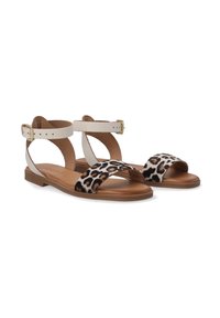 Leopardenmuster-Flachsandalen mit braunen Ledersohlen. Verfügt über weiße Riemen und einen verstellbaren Knöchelverschluss. Entworfen für Komfort und Stil.