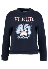 Felpa blu navy con un ricamo di una viola in blu, rosa e giallo con il testo "FLEUR" sopra, colletto e polsini a costine.