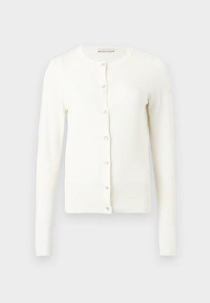 Cardigan blanc à manches longues avec encolure ronde et sept boutons devant, présenté à plat sur un fond gris clair.