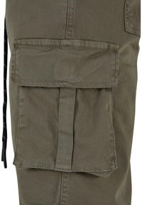 Olive green cargo pants featuring a large front flap pocket, stitched accents, and a smooth, durable fabric texture.