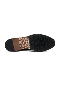 Black outsole with a textured grip, featuring a central brown panel with a patterned design of leaves and flowers in beige tones.