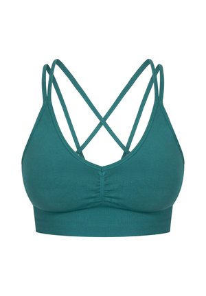 Soutien-gorge de sport teal avec un design sans couture, des bretelles croisées réglables dans le dos, et une bande élastique douce sous la poitrine.