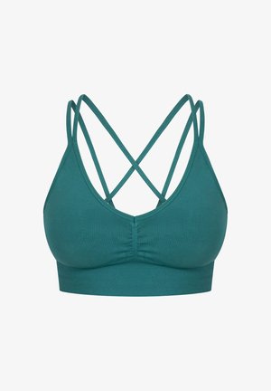 Soutien-gorge de sport teal avec un design sans couture, des bretelles croisées réglables dans le dos, et une bande élastique douce sous la poitrine.