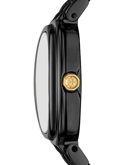 Vue latérale d'un boîtier de montre noir élégant avec une couronne hexagonale dorée portant un logo, et des points de fixation intégrés pour un bracelet noir.