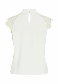 Haut blanc sans manches avec des manches courtes en dentelle et une petite ouverture en forme de goutte dans le dos, doté d'un col montant.