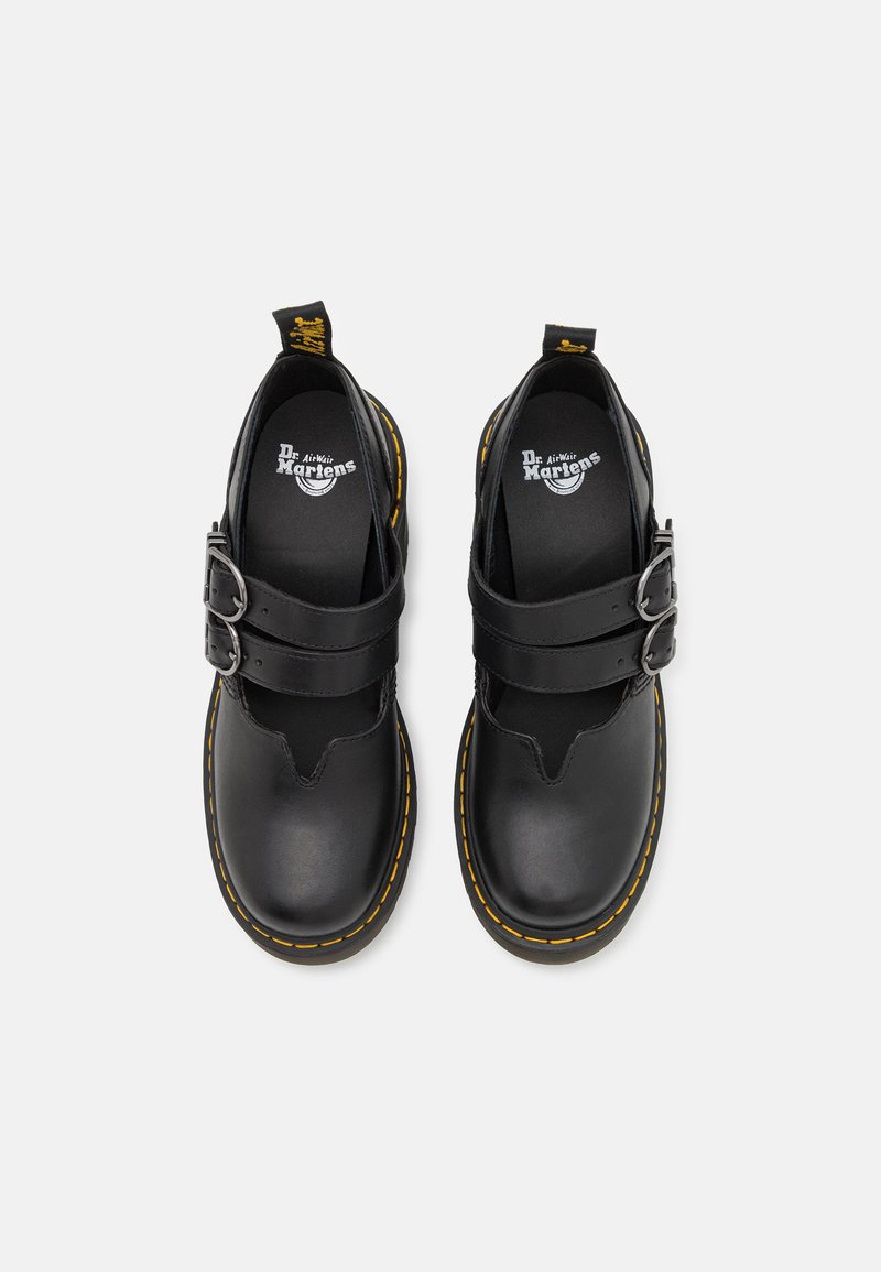 Schwarze Lederschuhe mit doppelten Schnallenriemen, gelber Naht und runder Zehenpartie. Logo auf der Innensohle sichtbar.
